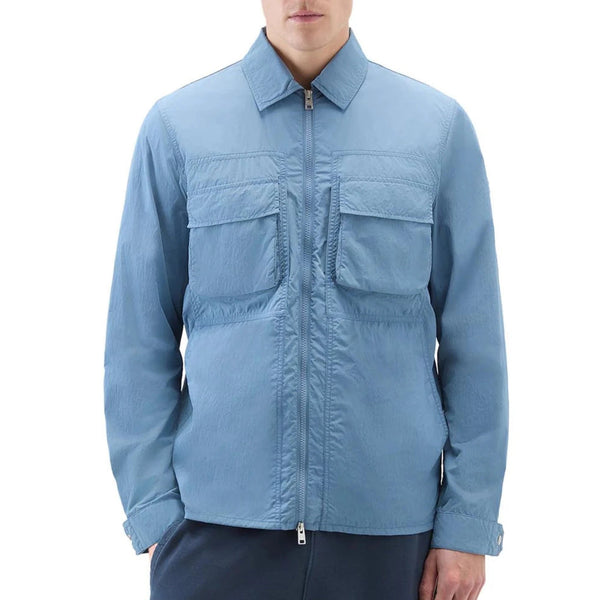 Woolrich Giubbino Giubbino Uomo Crinkle in nylon Celeste P24-WOOLRICHCFWOOS0119MRUT3718-31123-M - Francavilla Moda